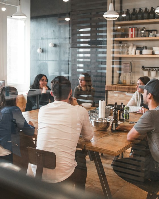 People in a meeting around a conference table