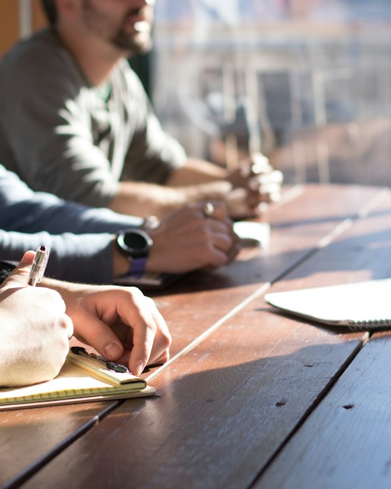 People at a table reviewing documents